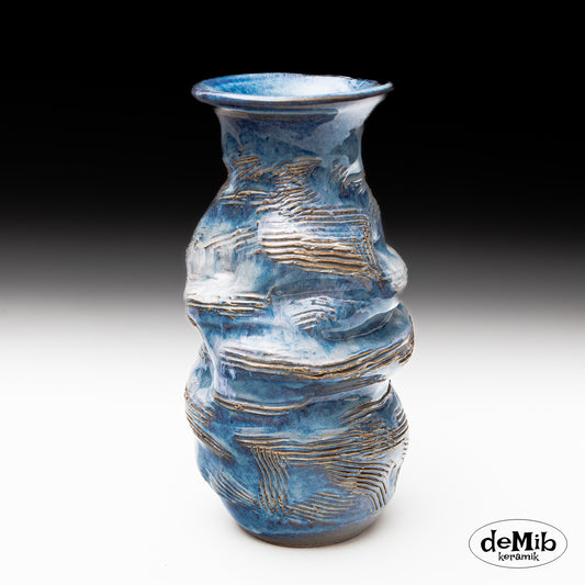 Tall Floating Blue Vase with Strong Textures